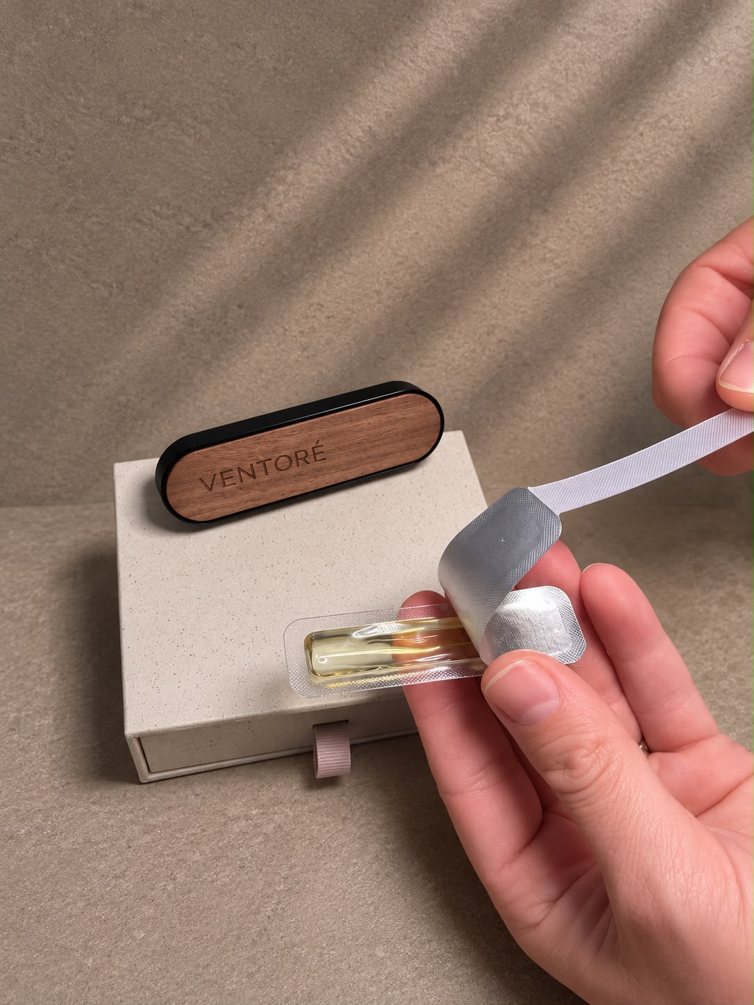 VENTORÉ car vent diffuser refill capsule being peeled open by hand