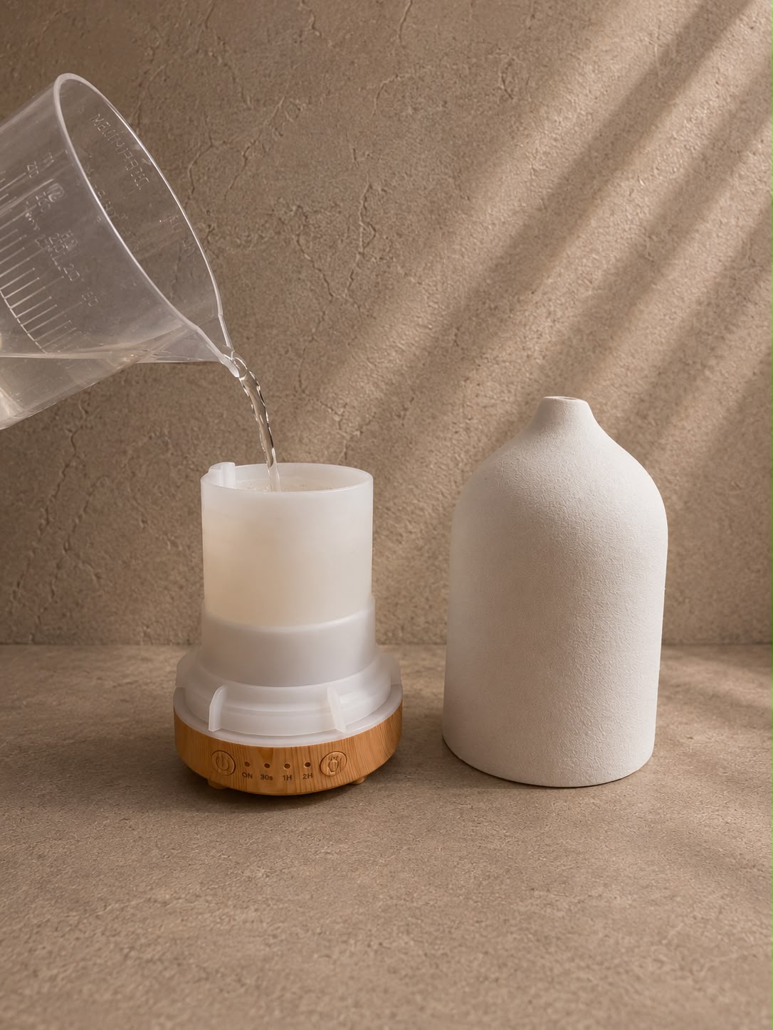 VENTORÉ Ceramic Water Diffuser – adding essential oil drops to the tank